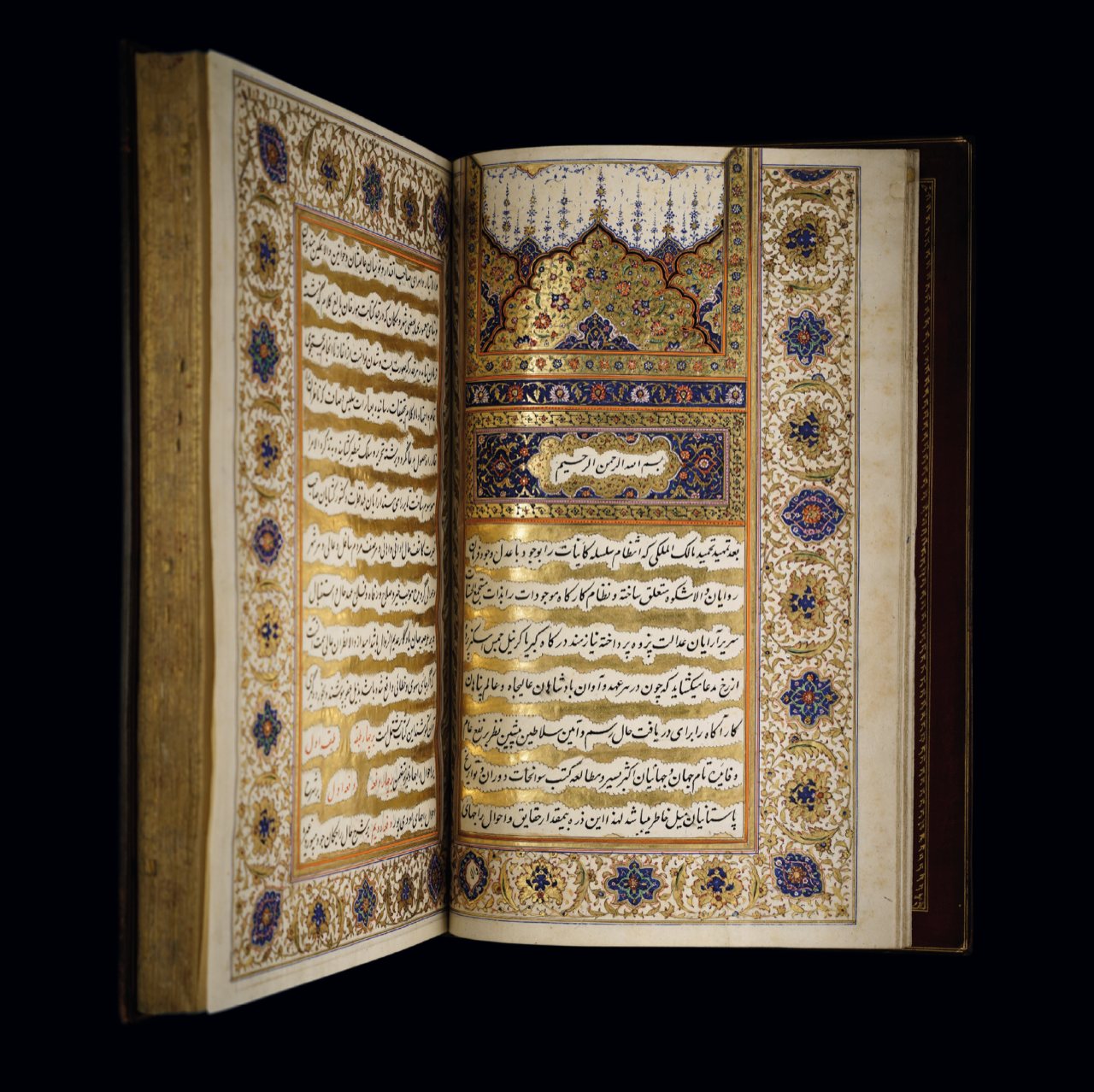 Richly illuminated manuscript with gilded borders and fine calligraphy, open across two pages